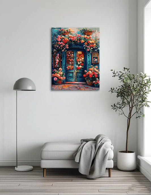 A colorful painting of flowers decorates the door of a charming flower shop.