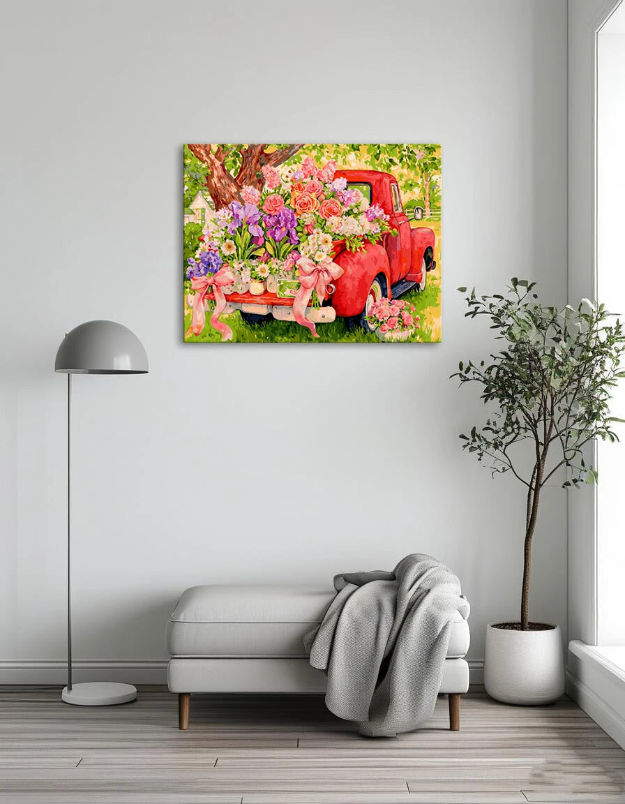 A vibrant painting of a red truck adorned with colorful flowers in the truck bed, set against a bright background.