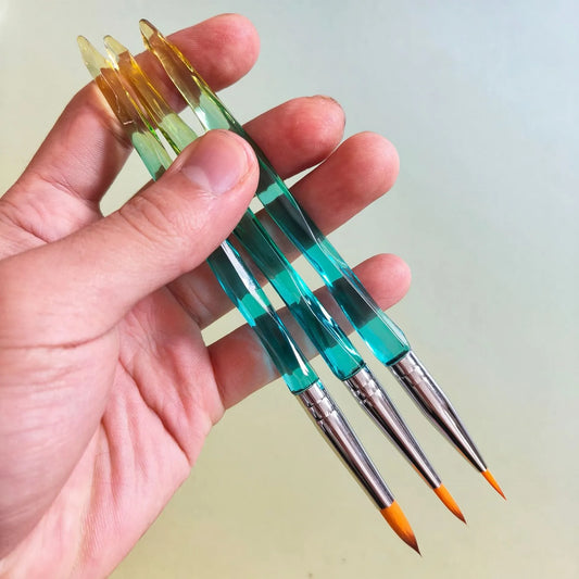 Three gradient green paintbrushes