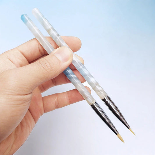 two paintbrushes