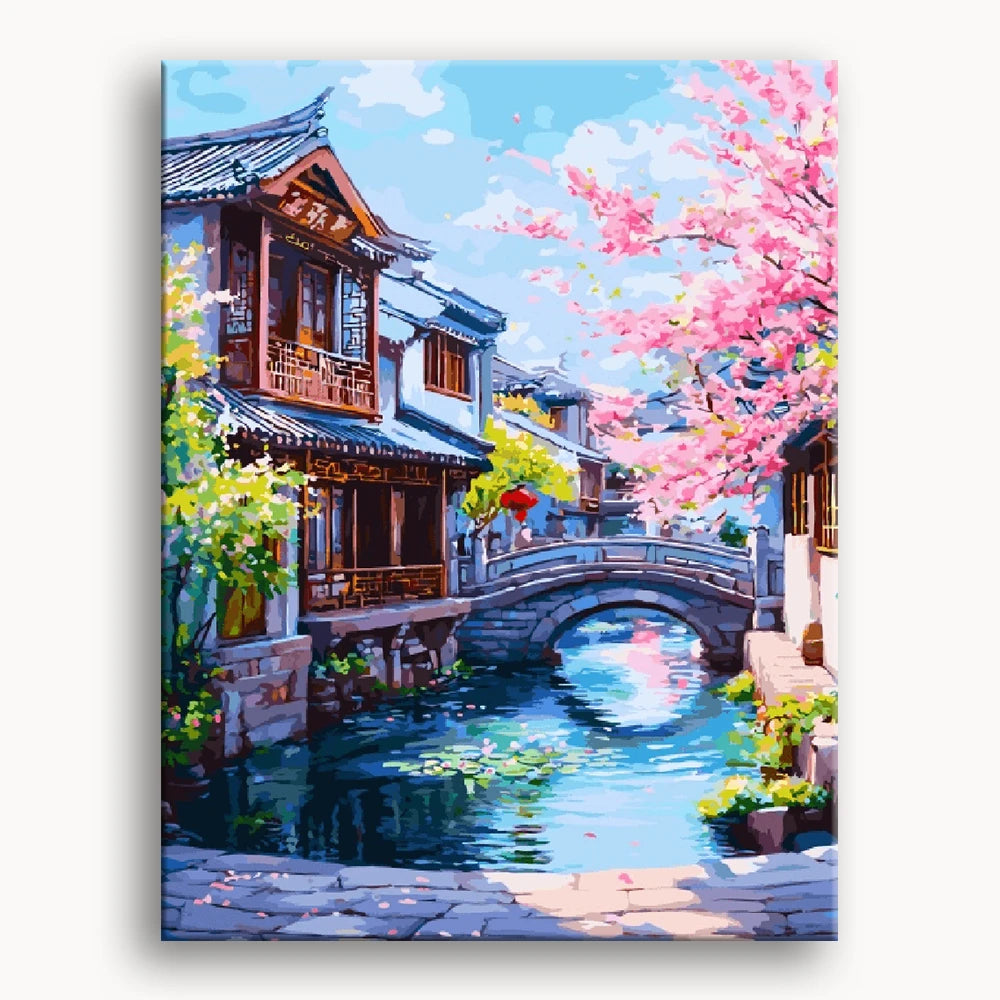 A serene painting of a village with a river flowing under a charming bridge.