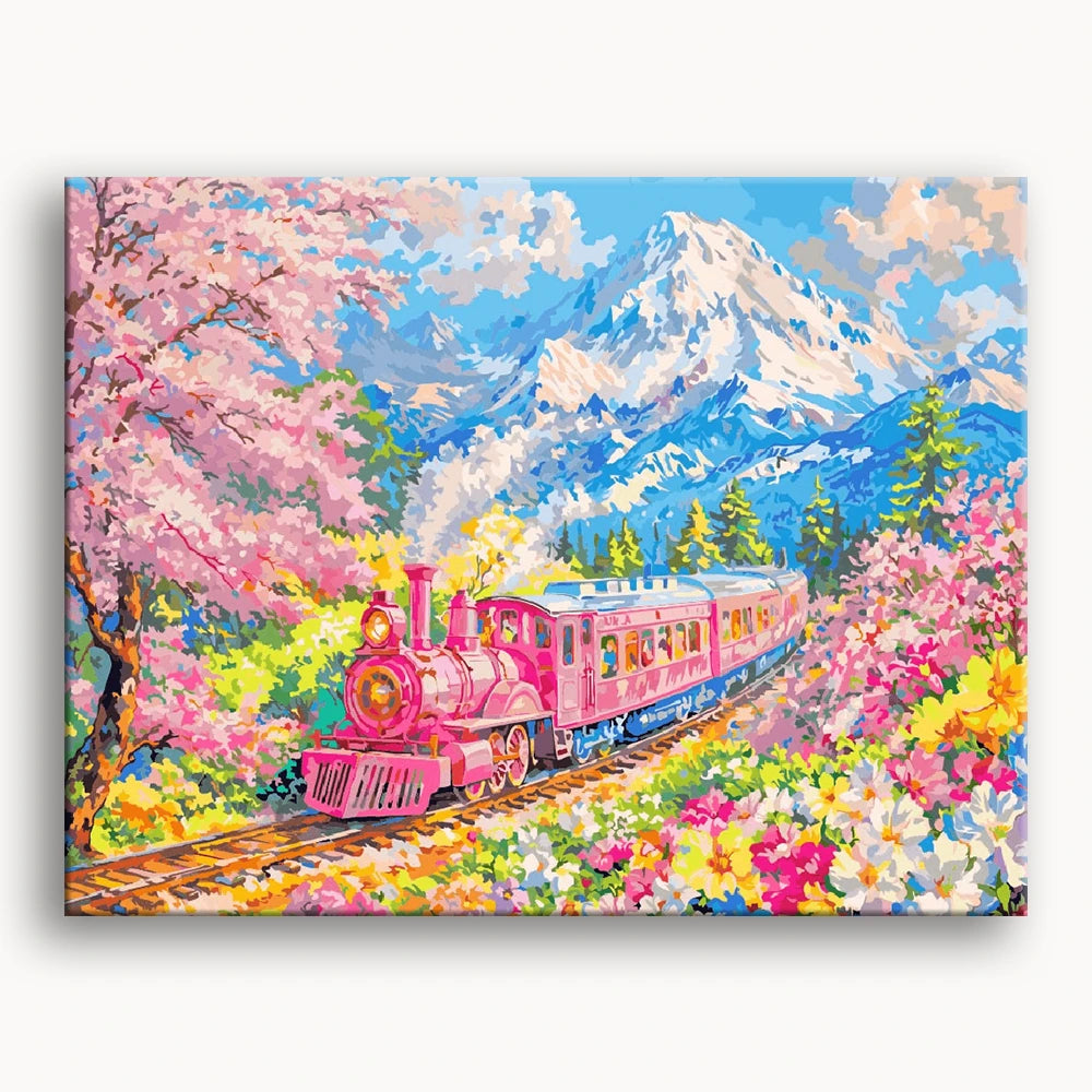 A pink train travels through a vibrant field of colorful flowers under a clear blue sky.