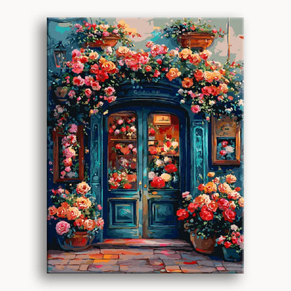 A colorful painting of flowers decorates the door of a charming flower shop.